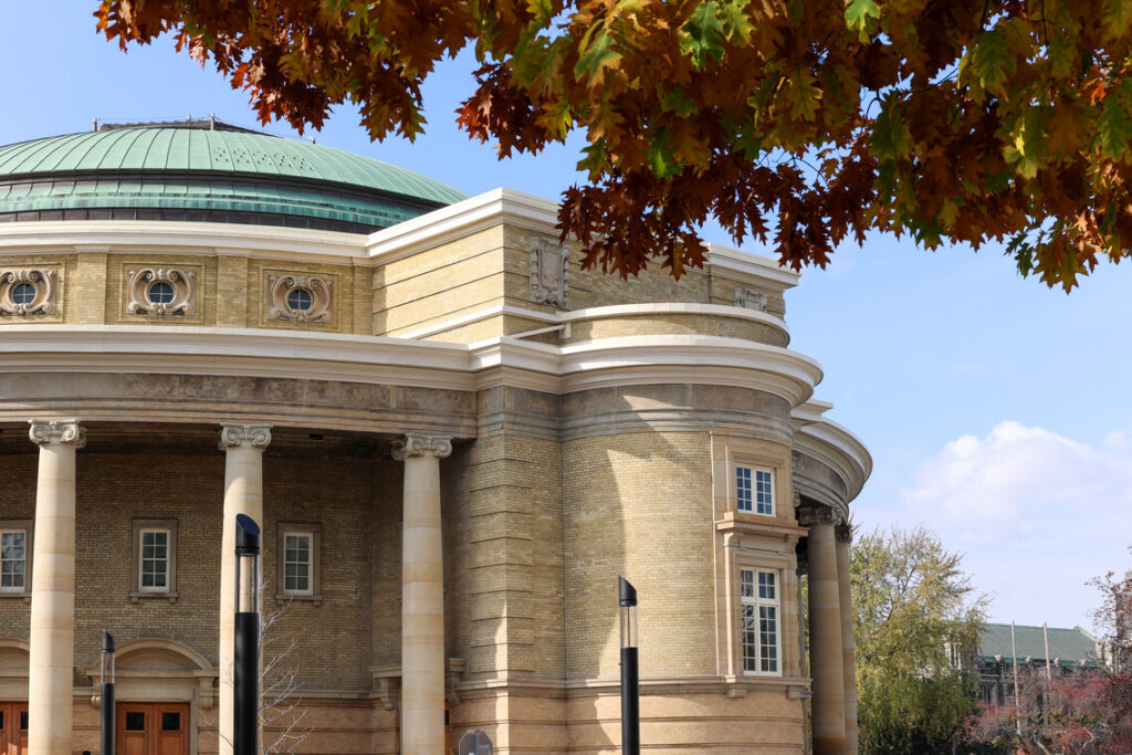 Convocation Hall with fall foliage infront of it